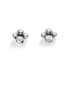 Pair of studs "FLEUR" from Spinning Jewelry, featuring sterling silver with cubic zirconias.