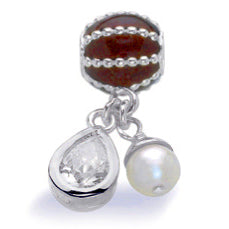 Necklace and bracelet charm in sterling silver with cubic zirconia and freshwater pearl.