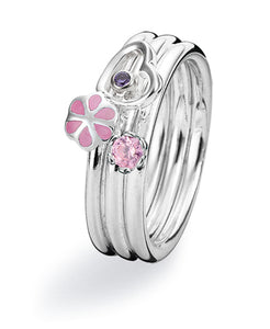 Sterling silver ring combination featuring amethyst cubic zirconia, pink cubic zirconia and enamel.