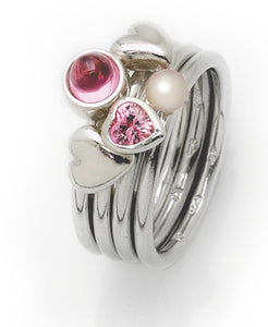 Sterling silver ring with pink heart cubic zirconia and freshwater pearl setting