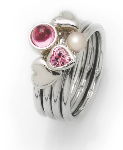 Sterling silver ring with pink heart cubic zirconia and freshwater pearl setting